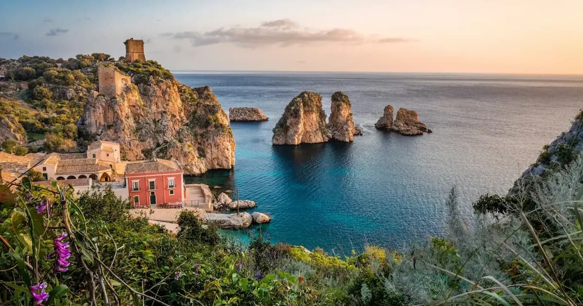 The sea stacks of Scopello on Sicily's coast at sunset, in southern Italy