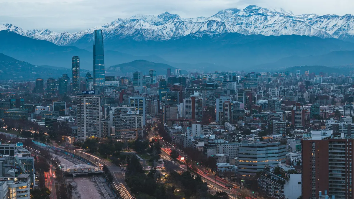 Santiago, Chile skyline with the Costanera Center tower and the snow-capped Andes behind it